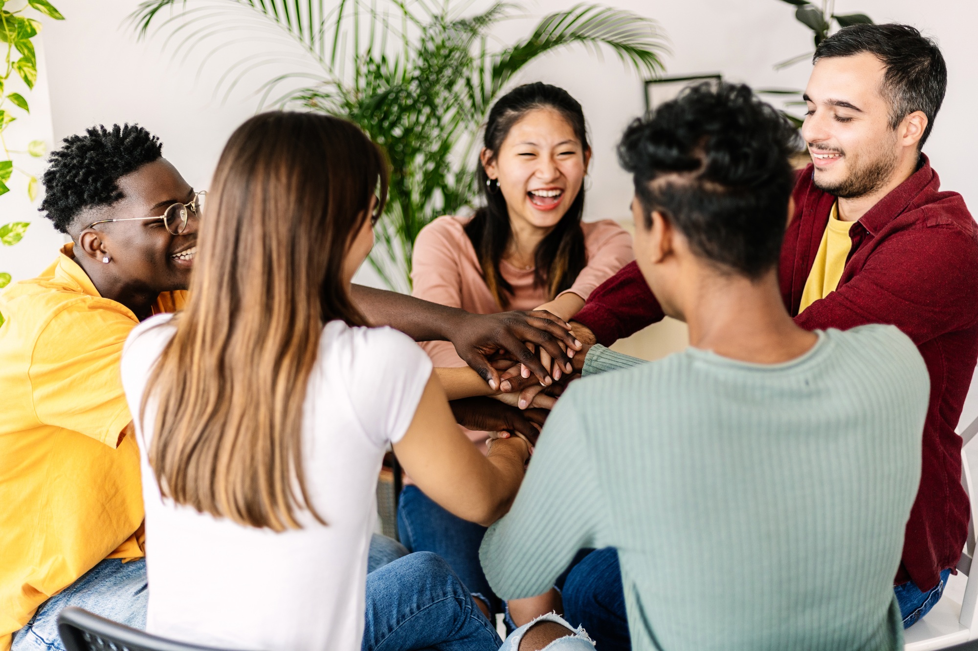 Diverse group of people gathered at therapy session. Help and support concept.