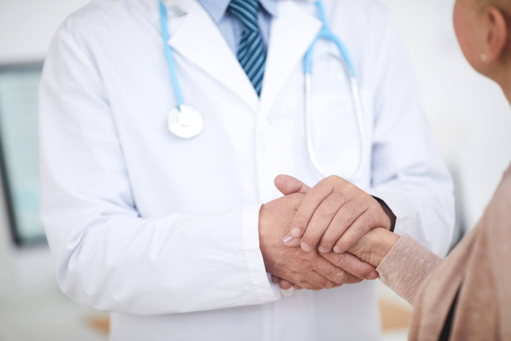 Doctor supporting patient